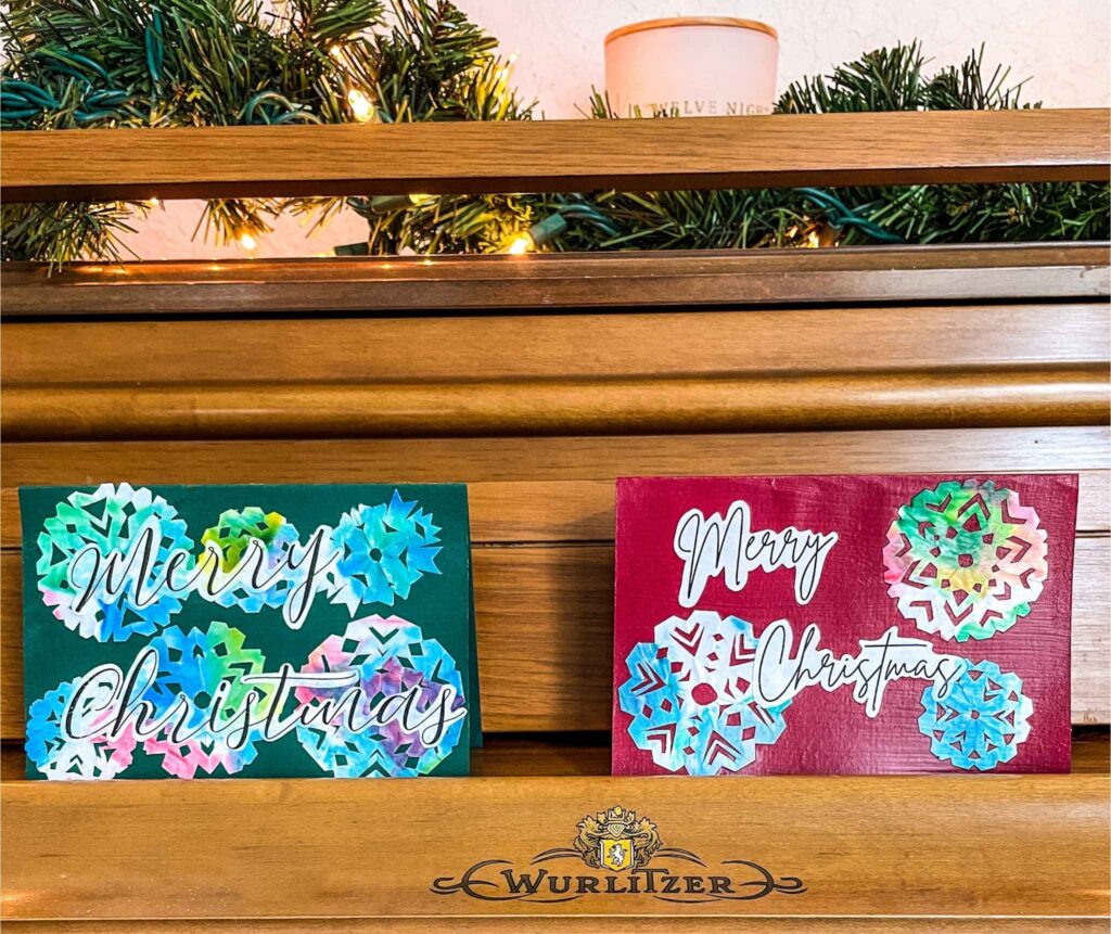 DIY Christmas cards sitting on piano
