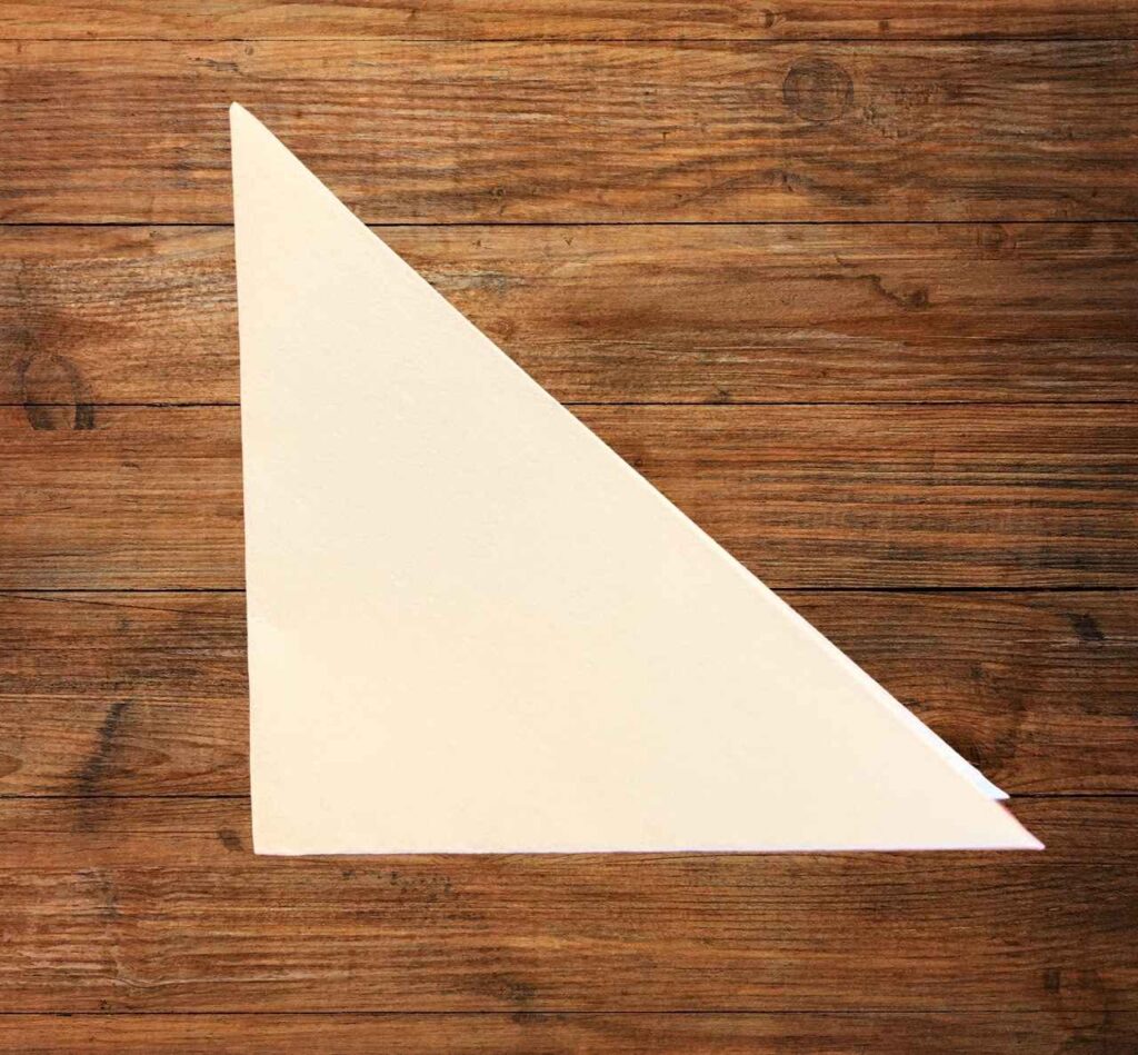 folding paper to make a snowflake