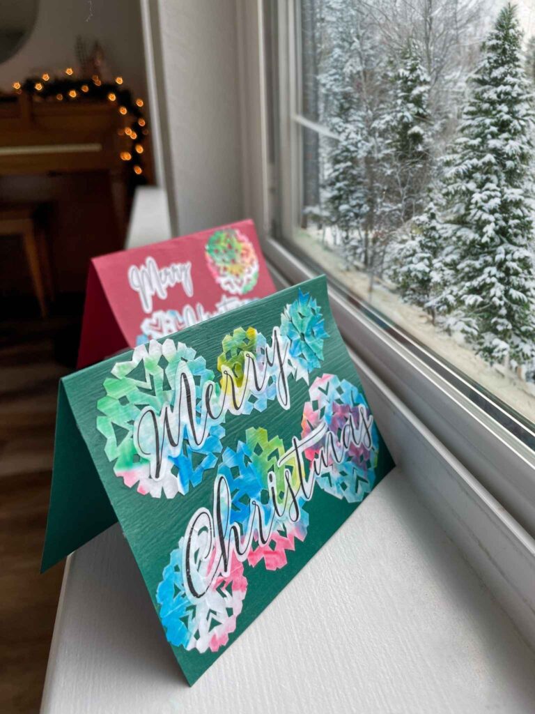 DIY Christmas cards sitting on the window sill