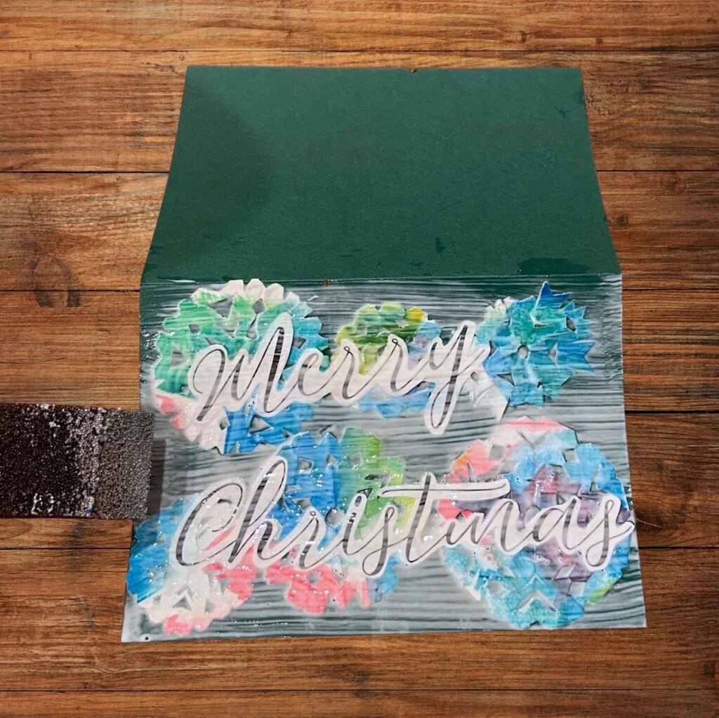 Mod podge layer over top of painted snowflake card