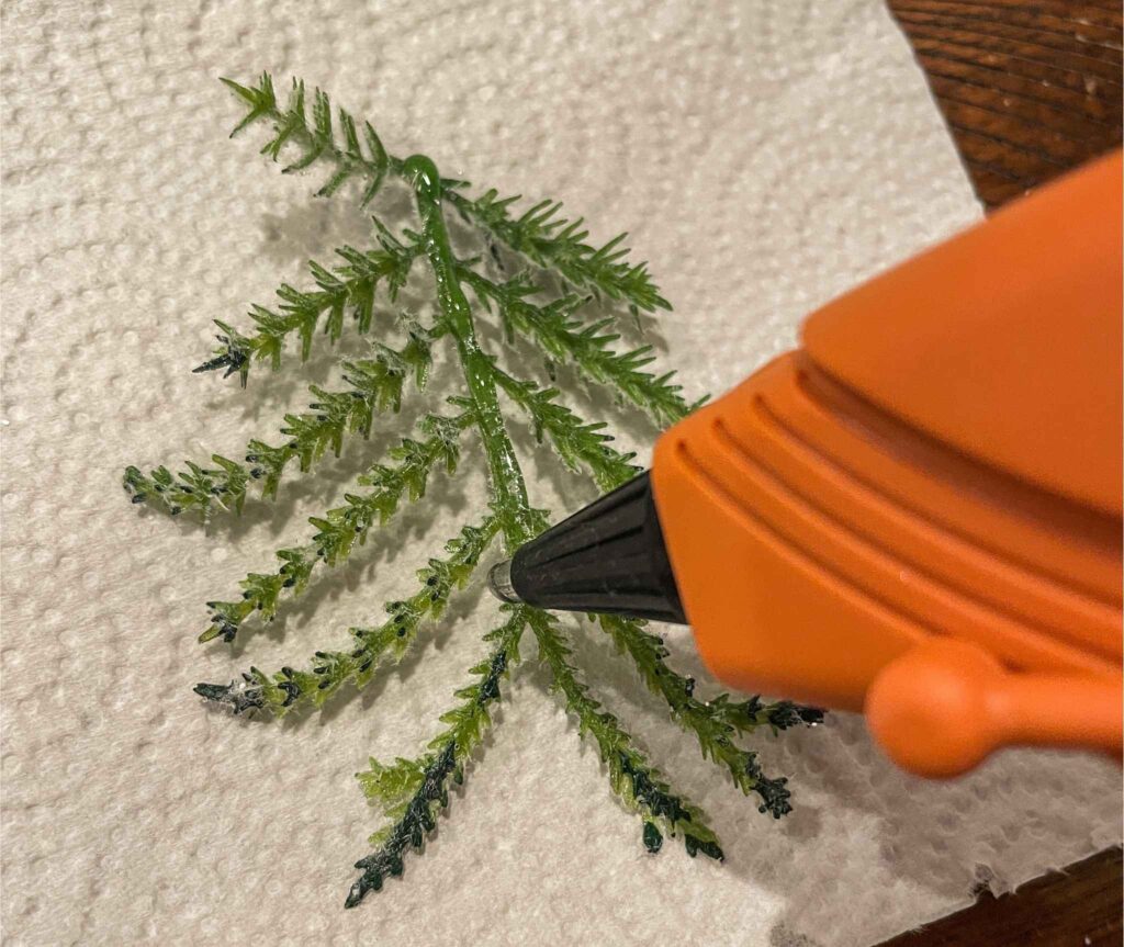 hot glue on faux tree branch