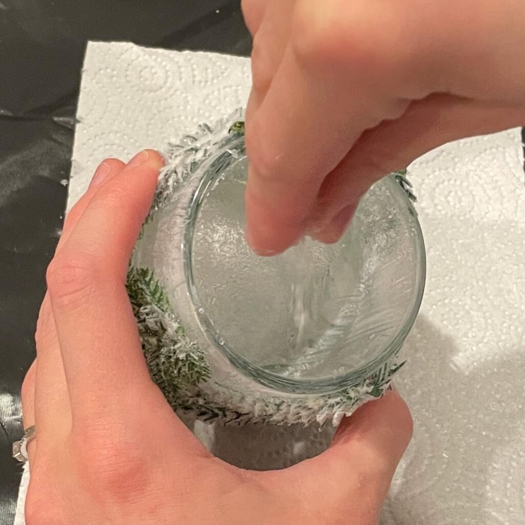 sprinkling epsom salt into votive